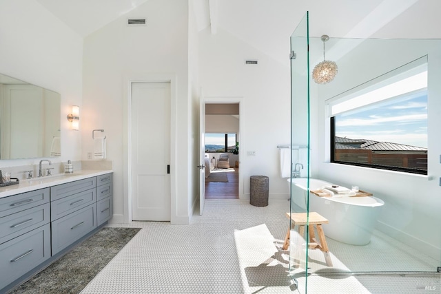 3878 Horizon View Way, Santa Rosa, CA 95404 - ensuite bathroom with high vaulted ceiling, vanity, a freestanding bath, beam ceiling, and baseboards