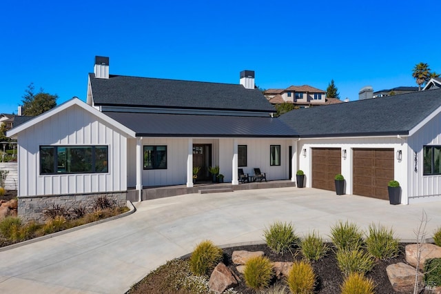 3878 Horizon View Way, Santa Rosa, CA 95404 - modern farmhouse with a porch, an attached garage, concrete driveway, board and batten siding, and a chimney