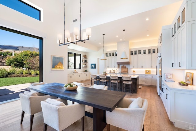3878 Horizon View Way, Santa Rosa, CA 95404 - dining space featuring light wood-type flooring, recessed lighting, a chandelier, and a high ceiling