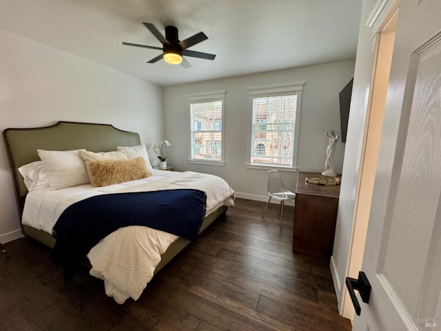 bedroom with baseboards, dark wood finished floors, and a ceiling fan