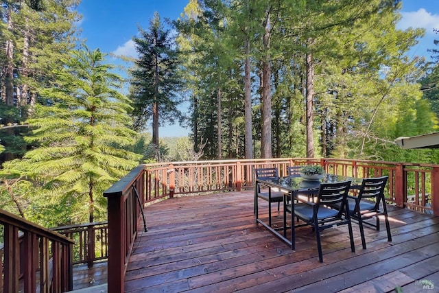 deck with outdoor dining area