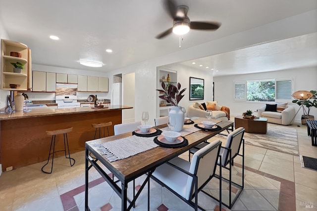 dining space with light tile patterned floors, ceiling fan, and recessed lighting