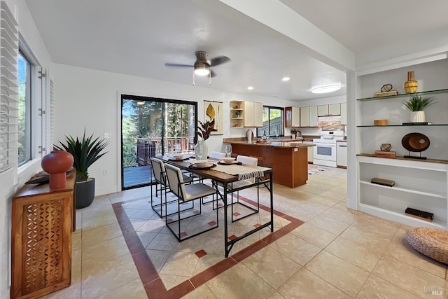 dining space with light tile patterned floors, ceiling fan, built in features, and recessed lighting