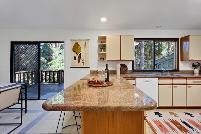 kitchen featuring open shelves, recessed lighting, white dishwasher, a sink, and a peninsula