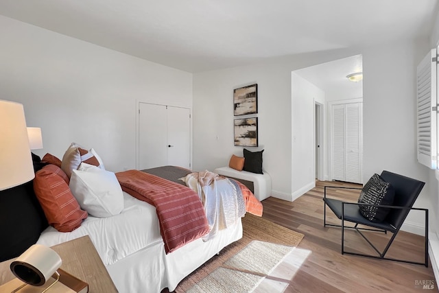 bedroom featuring light wood-type flooring and baseboards