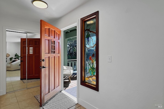 entryway with light tile patterned floors