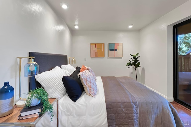 bedroom featuring baseboards and recessed lighting