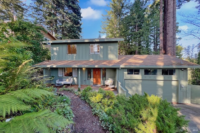 view of front of home with a porch and aphalt driveway