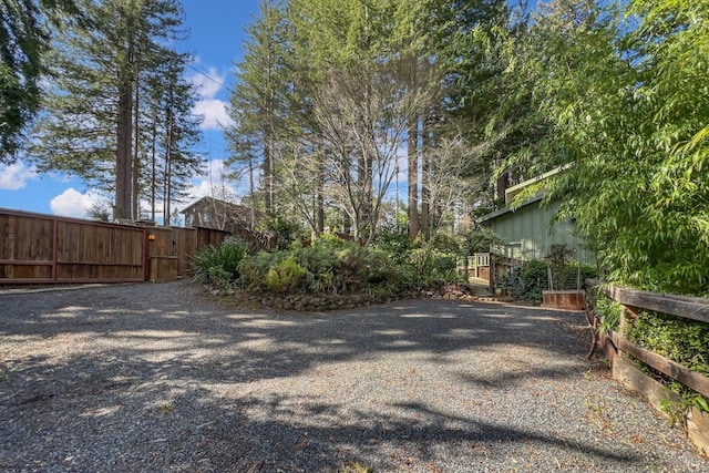 exterior space featuring fence and a gate