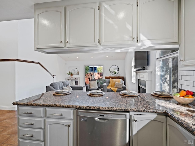 2108 Imola Ave Unit A, Napa, CA 94559 - kitchen featuring dishwasher, a peninsula, decorative backsplash, and dark stone counters