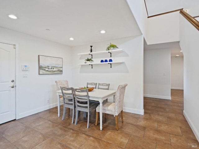 dining area featuring recessed lighting and baseboards