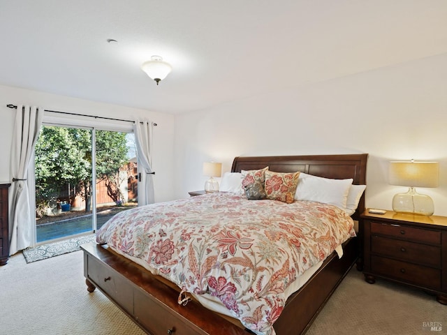 carpeted bedroom featuring access to exterior