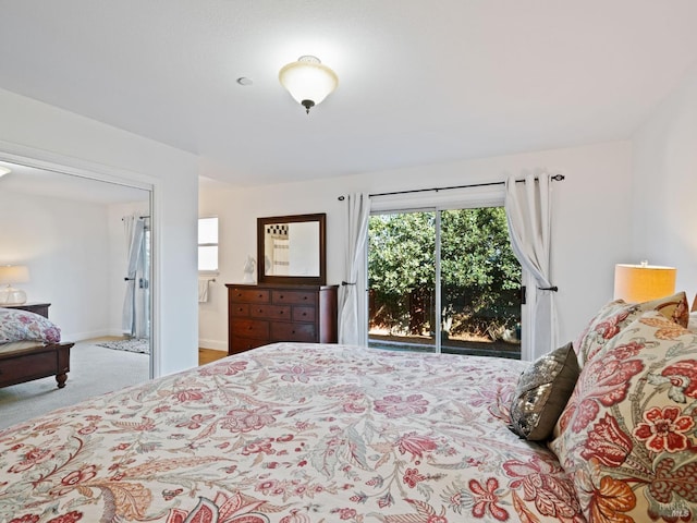 bedroom with access to exterior, carpet floors, and baseboards