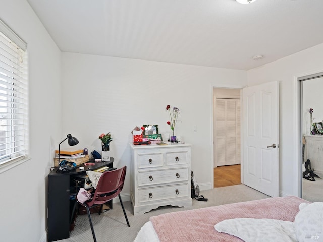 bedroom with carpet and baseboards