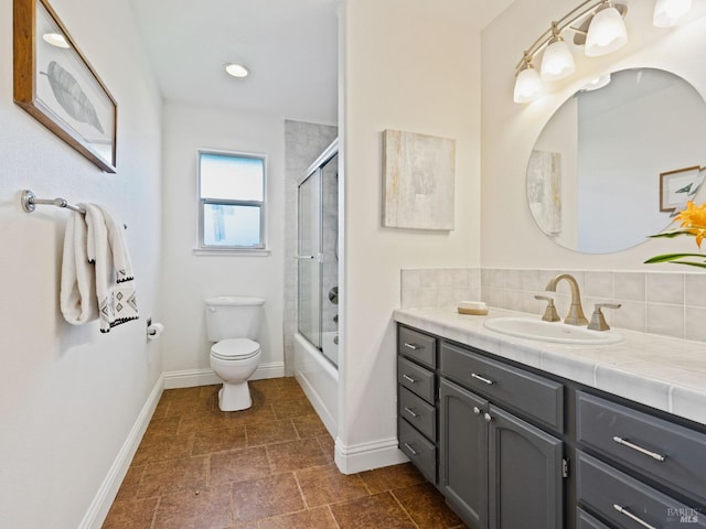 bathroom featuring decorative backsplash, vanity, toilet, and baseboards