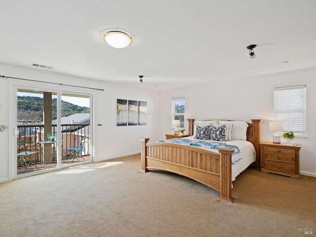 2108 Imola Ave Unit A, Napa, CA 94559 - carpeted bedroom featuring access to exterior and baseboards