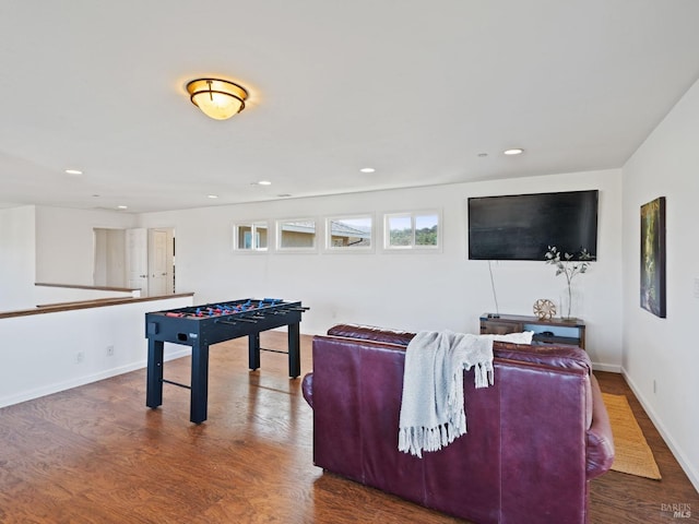 recreation room featuring recessed lighting, baseboards, and wood finished floors