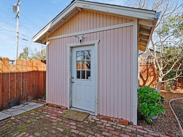 view of shed featuring a fenced backyard