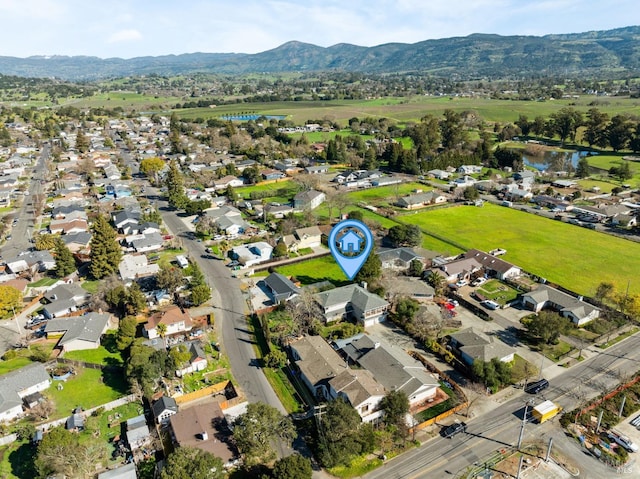 birds eye view of property featuring a residential view and a water and mountain view