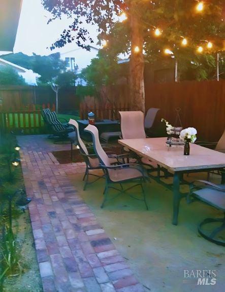 2108 Imola Ave Unit A, Napa, CA 94559 - view of patio / terrace featuring outdoor dining space and fence