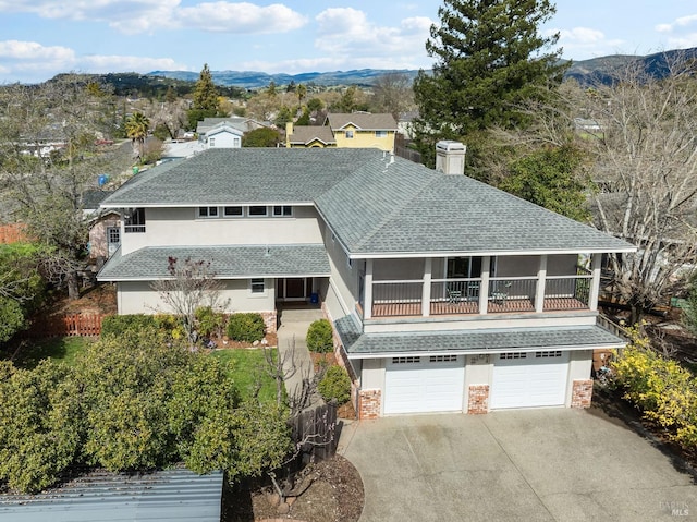2108 Imola Ave Unit A, Napa, CA 94559 - view of front of property with roof with shingles, driveway, an attached garage, a chimney, and stucco siding