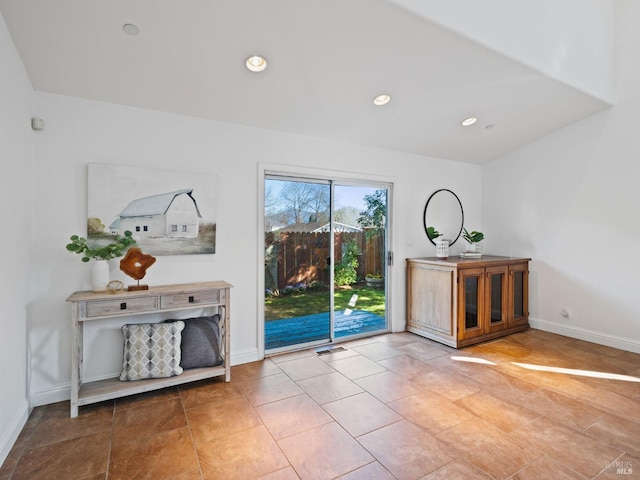 interior space featuring baseboards and recessed lighting