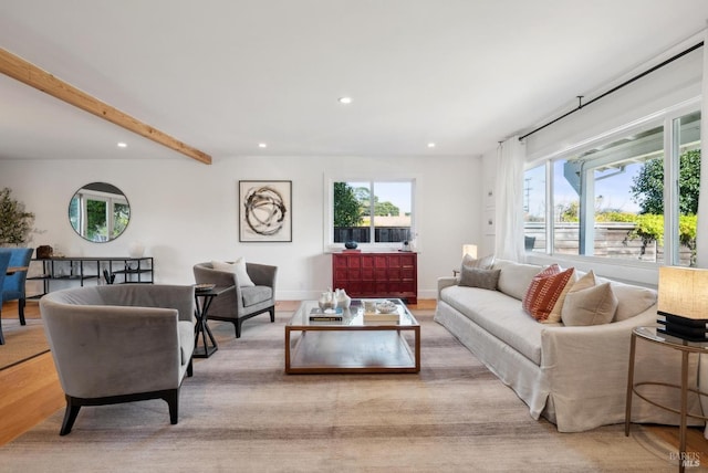 living room featuring recessed lighting, beam ceiling, baseboards, and wood finished floors