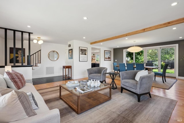 living area with visible vents, wood finished floors, stairs, beam ceiling, and recessed lighting