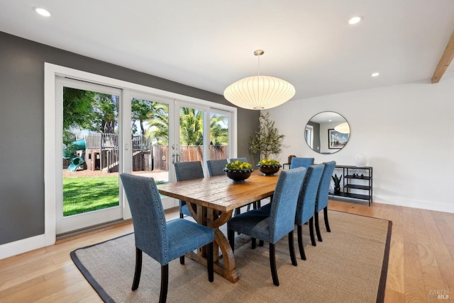 dining room with baseboards, recessed lighting, and light wood-style floors