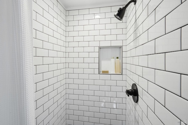 bathroom with tiled shower