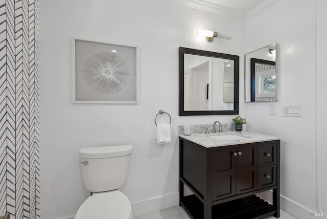 full bath with ornamental molding, vanity, toilet, and baseboards