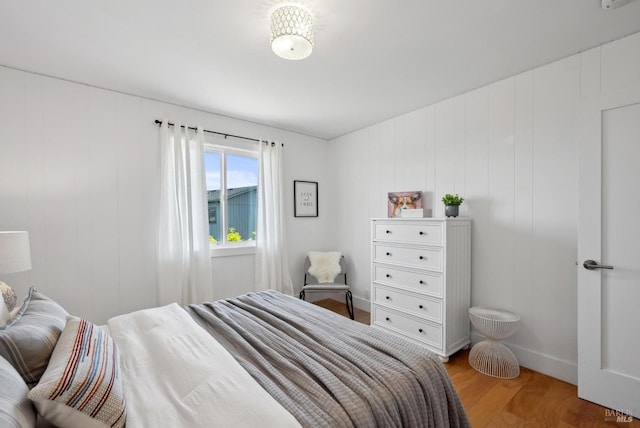 bedroom featuring light wood-style floors