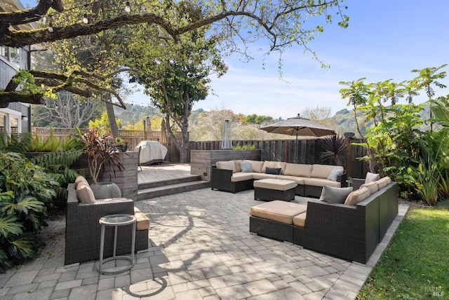 view of patio with a fenced backyard and an outdoor living space