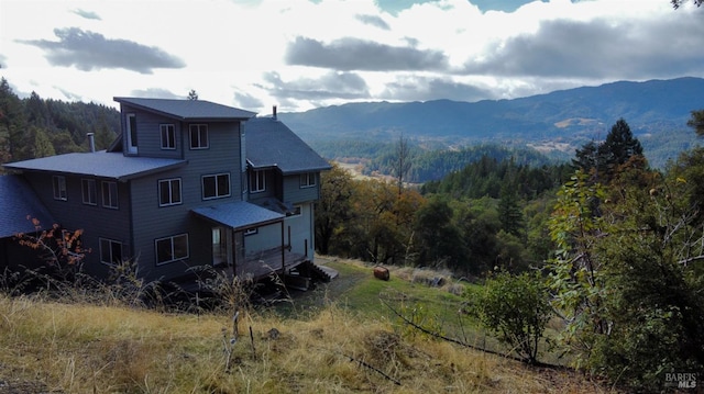 exterior space with a view of trees