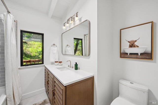 bathroom with toilet, shower / bath combo with shower curtain, vanity, beamed ceiling, and baseboards