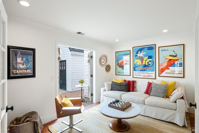 living room with visible vents, wood finished floors, and recessed lighting