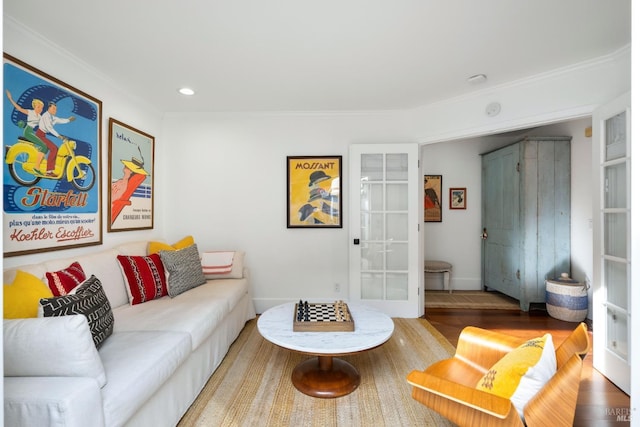 living area with ornamental molding, recessed lighting, french doors, and wood finished floors