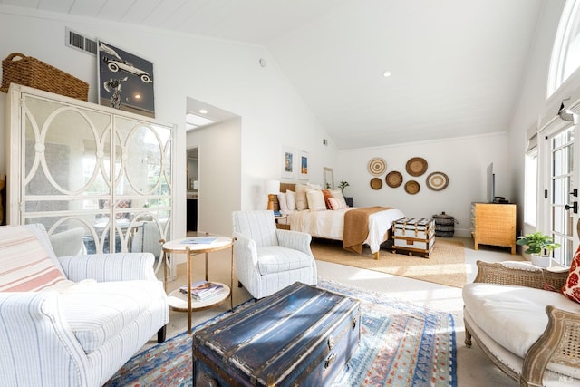 bedroom with high vaulted ceiling, carpet floors, and visible vents