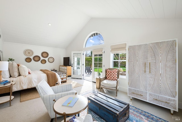 bedroom with carpet, access to outside, high vaulted ceiling, and french doors