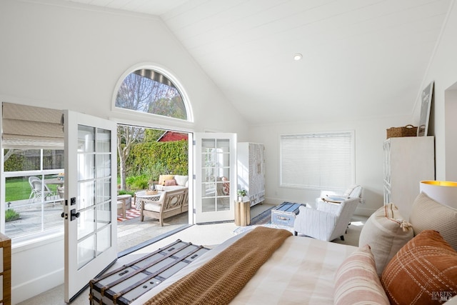 carpeted bedroom with access to outside, french doors, high vaulted ceiling, and baseboards