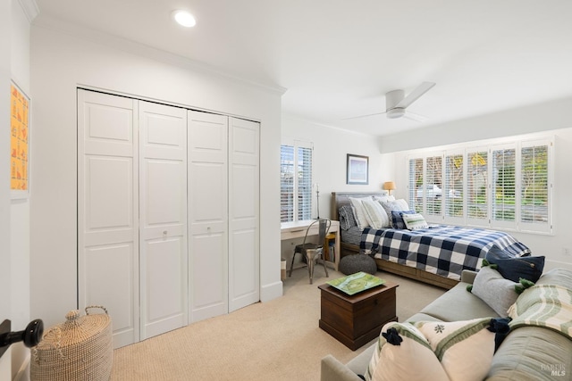 carpeted bedroom featuring ornamental molding, multiple windows, a closet, and recessed lighting