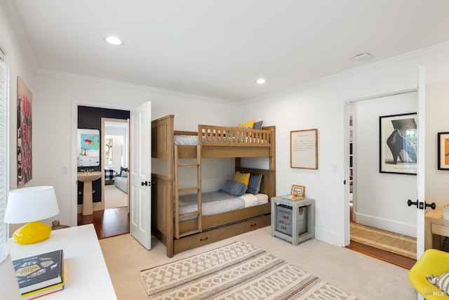 bedroom featuring baseboards, crown molding, and recessed lighting