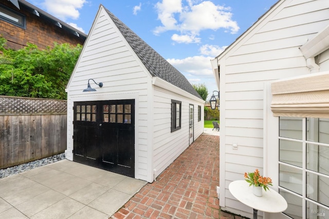 detached garage with fence