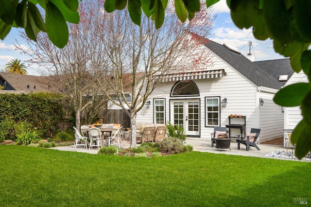 back of house featuring an outdoor fire pit, french doors, a patio, and fence