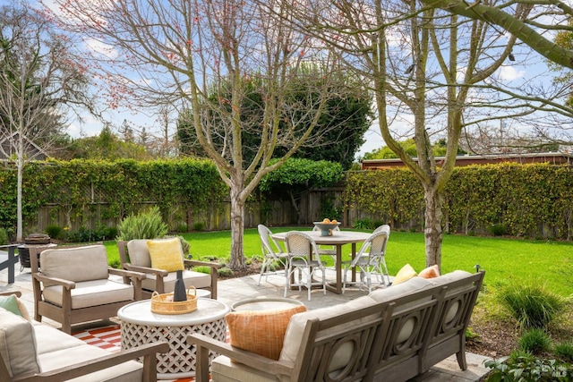 view of patio / terrace with a fenced backyard and an outdoor living space