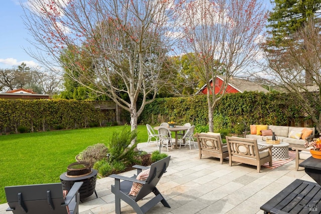 view of patio with fence and outdoor lounge area