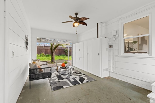 view of patio featuring an outdoor living space, a ceiling fan, and fence