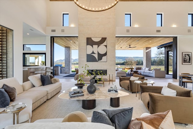 2350 Big Ranch Rd, Napa, CA 94558 - living area with a towering ceiling, a fireplace, and a chandelier