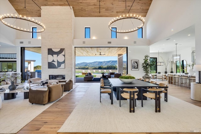 2350 Big Ranch Rd, Napa, CA 94558 - dining room featuring a towering ceiling, wood finished floors, a chandelier, wooden ceiling, and a mountain view