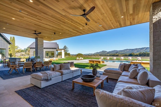 2350 Big Ranch Rd, Napa, CA 94558 - view of patio / terrace with a mountain view, an outdoor living space, outdoor dining area, and a ceiling fan